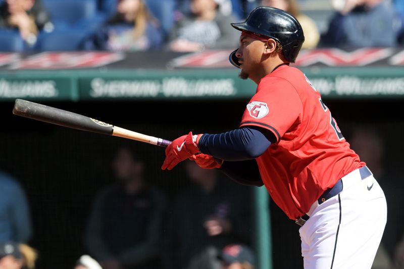 Apr 21, 2024; Cleveland, Ohio, USA; Cleveland Guardians designated hitter Josh Naylor (22) hits a three run RBI double during the seventh inning against the Oakland Athletics at Progressive Field. Mandatory Credit: Ken Blaze-USA TODAY Sports