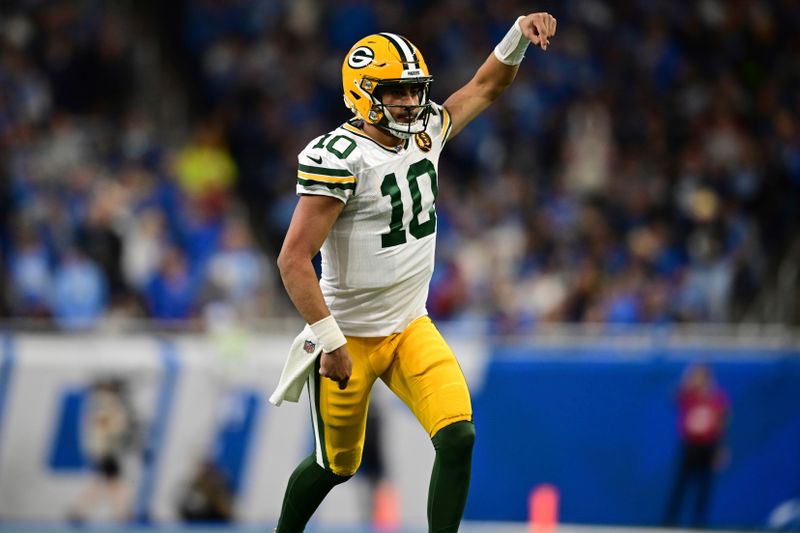 Green Bay Packers quarterback Jordan Love celebrates after throwing a touchdown pass during the second half of an NFL football game against the Detroit Lions, Thursday, Nov. 23, 2023, in Detroit. The Packers won 29-22. (AP Photo/David Dermer)