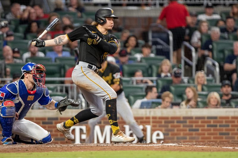 Sep 9, 2023; Cumberland, Georgia, USA; Pittsburgh Pirates center fielder Jack Suwinski (65) bats against Atlanta Braves in the sixth inning at Truist Park. Mandatory Credit: Jordan Godfree-USA TODAY Sports