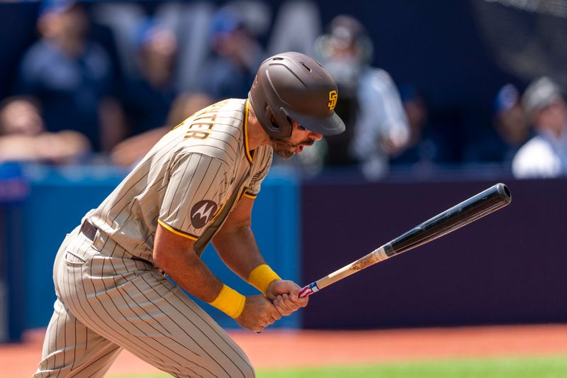 Jul 20, 2023; Toronto, Ontario, CAN; San Diego Padres designated hitter Matt Carpenter (14) reacts after popping out against the Toronto Blue Jays during the second inning at Rogers Centre. Mandatory Credit: Kevin Sousa-USA TODAY Sports