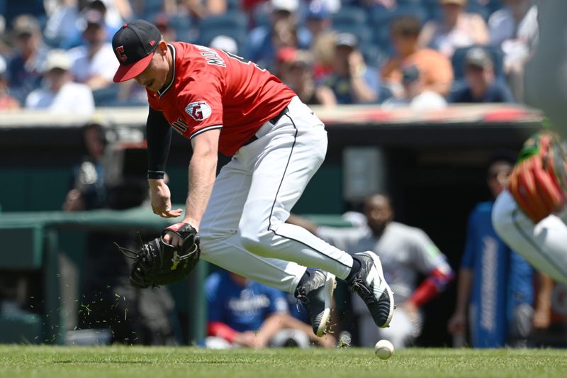 Jun 26, 2025; Cleveland, Ohio, USA; Cleveland Guardians first baseman Kyle Manzardo (9) makes an error on a bunt by Toronto Blue Jays center fielder Myles Straw (not pictured) during the third inning at Progressive Field. Mandatory Credit: Ken Blaze-Imagn Images