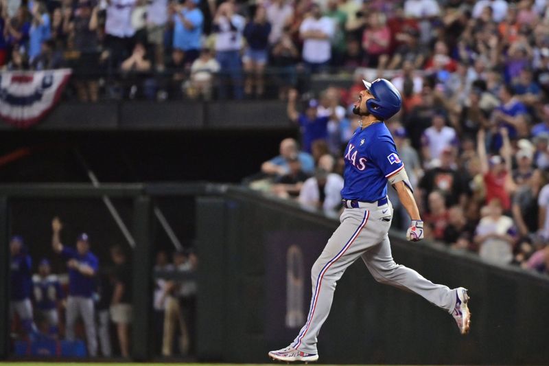 Nov 1, 2023; Phoenix, AZ, USA; Texas Rangers second baseman Marcus Semien (2) runs the bases after hitting a home run in the ninth inning against the Arizona Diamondbacks in game five of the 2023 World Series at Chase Field. Mandatory Credit: Matt Kartozian-USA TODAY Sports