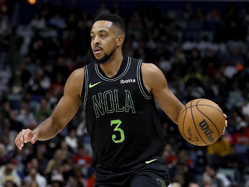 NEW ORLEANS, LOUISIANA - JANUARY 23: CJ McCollum #3 of the New Orleans Pelicans dribbles the ball down court during the third quarter of an NBA game against the Utah Jazz at Smoothie King Center on January 23, 2024 in New Orleans, Louisiana. NOTE TO USER: User expressly acknowledges and agrees that, by downloading and or using this photograph, User is consenting to the terms and conditions of the Getty Images License Agreement. (Photo by Sean Gardner/Getty Images)