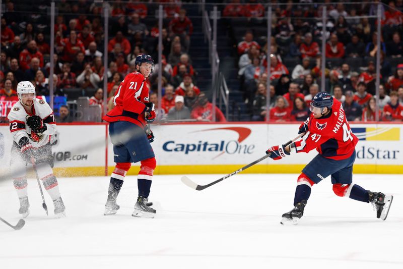 Feb 26, 2024; Washington, District of Columbia, USA; Washington Capitals left wing Beck Malenstyn (47) scores a goalas Ottawa Senators defenseman Thomas Chabot (72) defends in the first period at Capital One Arena. Mandatory Credit: Geoff Burke-USA TODAY Sports