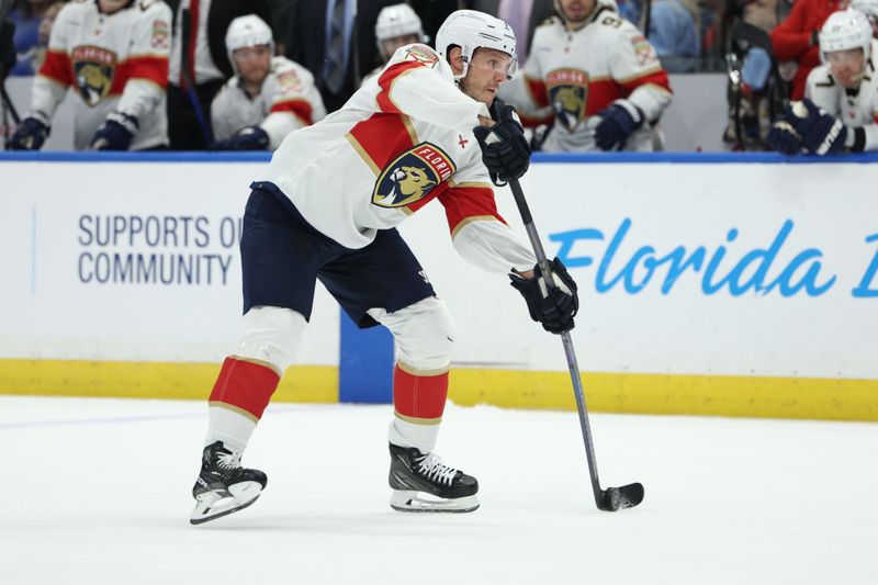 Feb 17, 2024; Tampa, Florida, USA;  Florida Panthers defenseman Dmitry Kulikov (7) controls the puck against the Tampa Bay Lightning in the second period at Amalie Arena. Mandatory Credit: Nathan Ray Seebeck-USA TODAY Sports