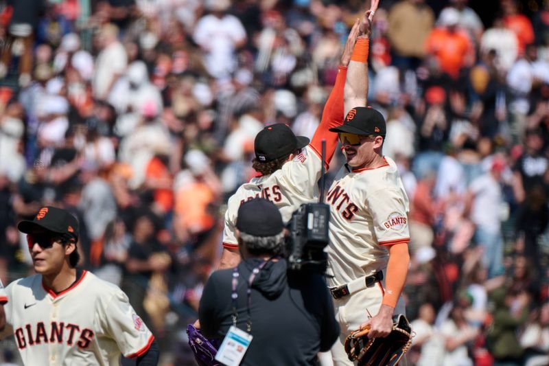 May 4, 2025; San Francisco, California, USA; San Francisco Giants shortstop Willy Adames (2) leaps to celebrate with outfielder Mike Yastrzemski (5) after the last out of the game against the Colorado Rockies at Oracle Park. Mandatory Credit: Robert Edwards-Imagn Images