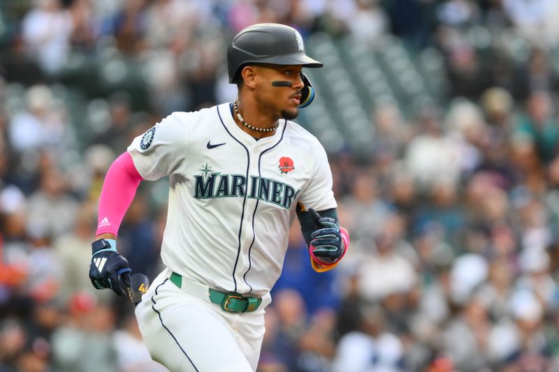 May 27, 2024; Seattle, Washington, USA; Seattle Mariners center fielder Julio Rodriguez (44) runs towards first base after hitting a single against the Houston Astros during the first inning at T-Mobile Park. Mandatory Credit: Steven Bisig-USA TODAY Sports