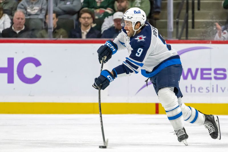 Nov 25, 2024; Saint Paul, Minnesota, USA;  Winnipeg Jets forward Alex Iafallo (9) makes a pass against the Minnesota Wild during the third period at Xcel Energy Center. Mandatory Credit: Nick Wosika-Imagn Images