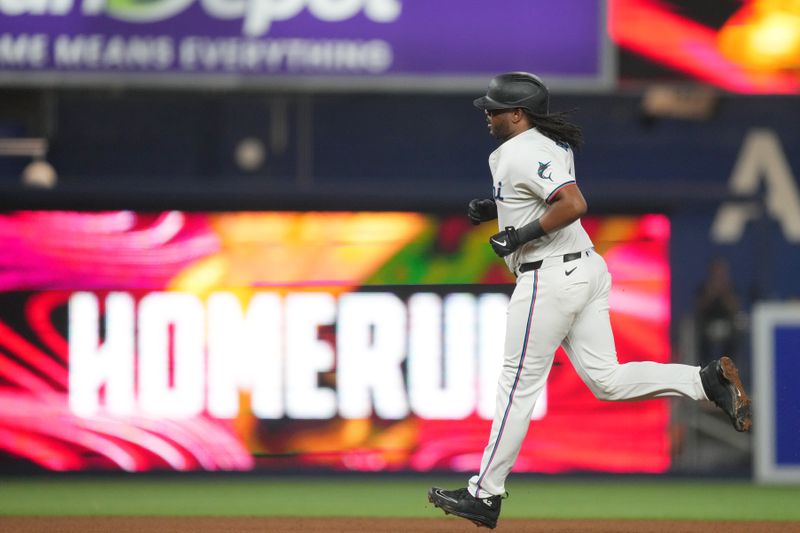 Jul 24, 2024; Miami, Florida, USA;  Miami Marlins first baseman Josh Bell (9) rounds the bases after hitting a solo hime run in the fourth inning against the Baltimore Orioles at loanDepot Park. Mandatory Credit: Jim Rassol-USA TODAY Sports