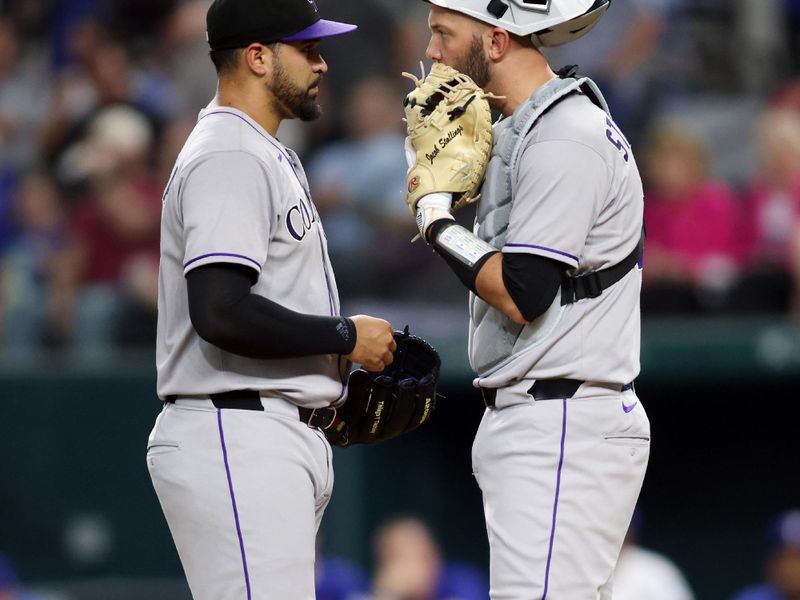 May 14, 2025; Arlington, Texas, USA; Colorado Rockies catcher Jacob Stallings (25) talks to pitcher Antonio Senzatela (49) during the first inning against the Texas Rangers at Globe Life Field. Mandatory Credit: Tim Heitman-Imagn Images