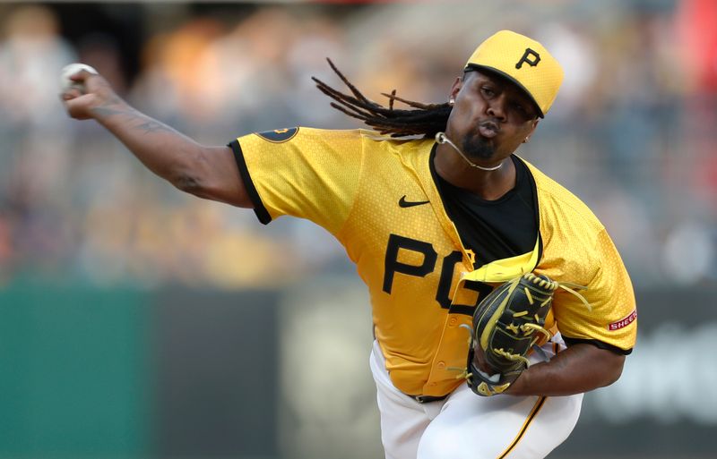 Sep 13, 2024; Pittsburgh, Pennsylvania, USA;  Pittsburgh Pirates starting pitcher Luis L. Ortiz (48) delivers a pitch against the Kansas City Royals during the first inning at PNC Park. Mandatory Credit: Charles LeClaire-Imagn Images