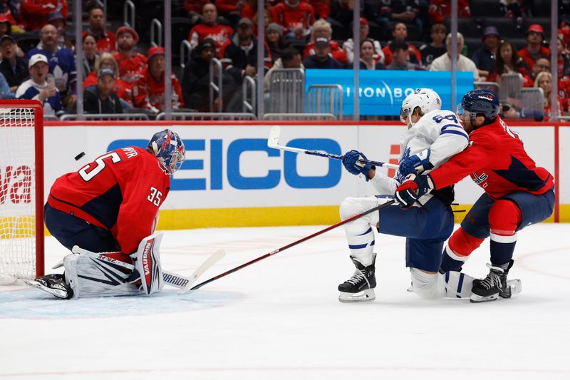 Oct 24, 2023; Washington, District of Columbia, USA; Toronto Maple Leafs right wing William Nylander (88) scores a goal on Washington Capitals goaltender Darcy Kuemper (35) as Capitals defenseman Nick Jensen (3) defends in the second period at Capital One Arena. Mandatory Credit: Geoff Burke-USA TODAY Sports