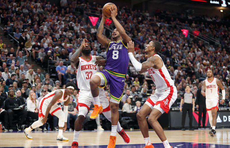 SALT LAKE CITY, UT - APRIL 11:  Brice Sensabaugh #8 of the Utah Jazz drives to the basket against Jeff Green #32 and Jabari Smith Jr., #10 of Houston Rockets during the second half of their game at the Delta Center on April 11, 2024 in Salt Lake City, Utah. NOTE TO USER: User expressly acknowledges and agrees that, by downloading and or using this photograph, User is consenting to the terms and conditions of the Getty Images License Agreement. Photo by Chris Gardner/Getty Images)