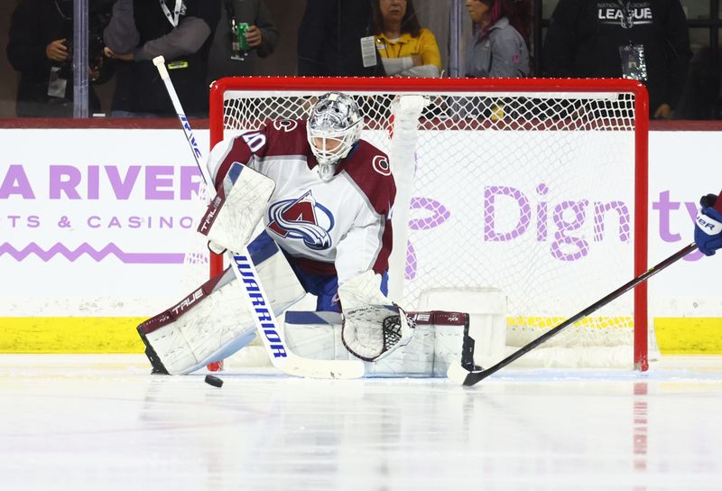 Nov 30, 2023; Tempe, Arizona, USA; Colorado Avalanche goalie Alexandar Georgiev (40) stops a shot on goal by the Arizona Coyotes in the third period at Mullett Arena. Mandatory Credit: Mark J. Rebilas-USA TODAY Sports