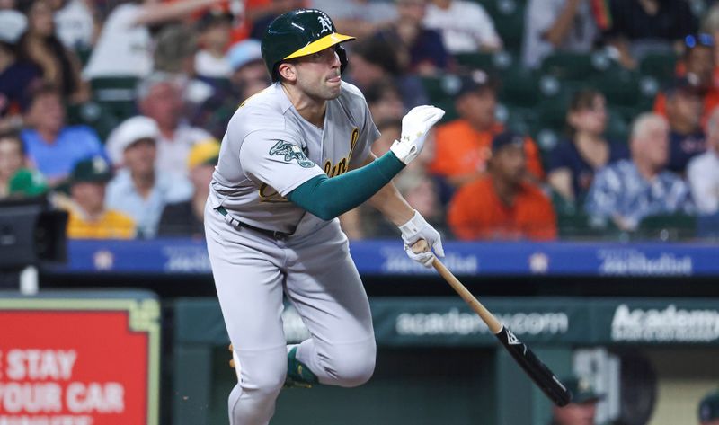 Sep 11, 2023; Houston, Texas, USA; Oakland Athletics third baseman Kevin Smith (4) hits a double during the fifth inning against the Houston Astros at Minute Maid Park. Mandatory Credit: Troy Taormina-USA TODAY Sports