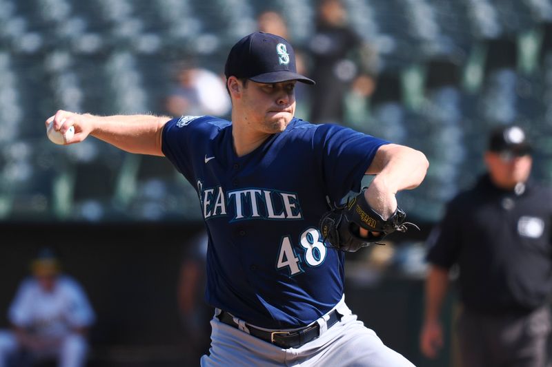 Sep 20, 2023; Oakland, California, USA; Seattle Mariners relief pitcher George Kirby (68) throws against the Oakland Athletics during the ninth inning at Oakland-Alameda County Coliseum. Mandatory Credit: Kelley L Cox-USA TODAY Sports