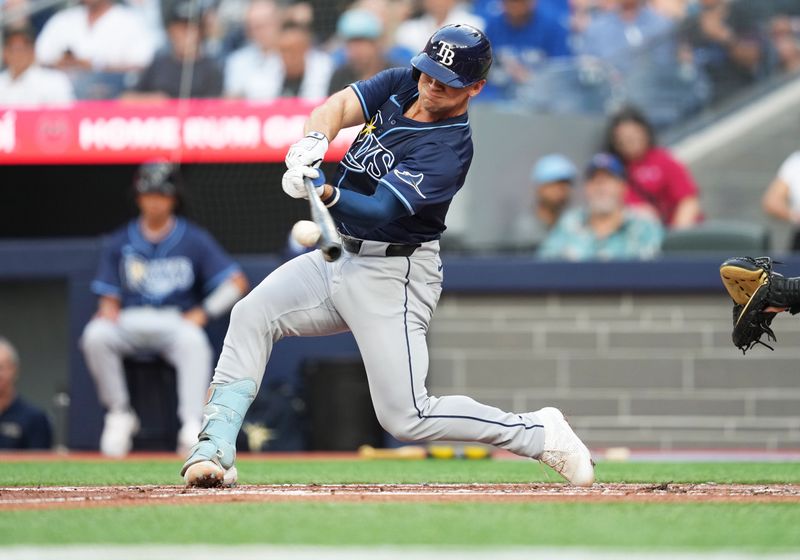 Jul 23, 2024; Toronto, Ontario, CAN; Tampa Bay Rays catcher Ben Rortvedt (30) hits a double against the Toronto Blue Jays during the second inning at Rogers Centre. Mandatory Credit: Nick Turchiaro-USA TODAY Sports