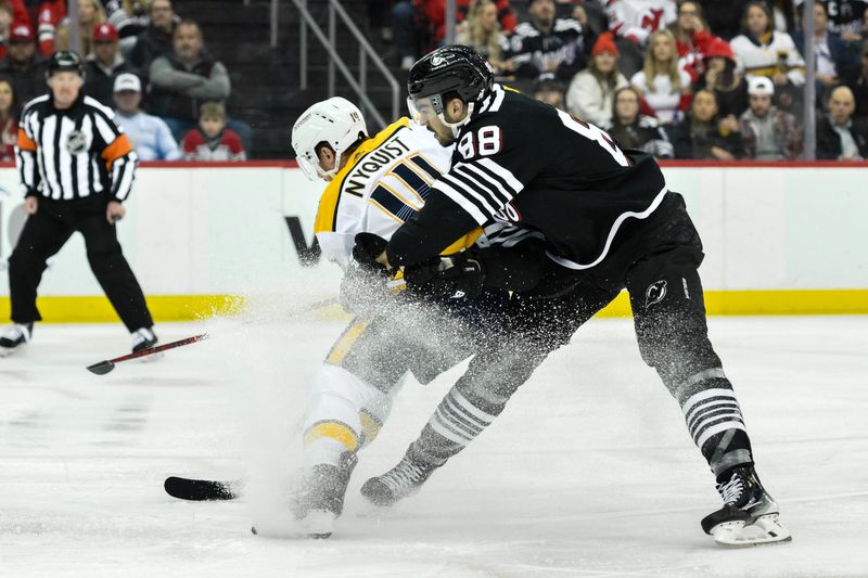 Apr 7, 2024; Newark, New Jersey, USA; Nashville Predators center Gustav Nyquist (14) skates with the puck while being defended by New Jersey Devils defenseman Kevin Bahl (88) during the first period at Prudential Center. Mandatory Credit: John Jones-USA TODAY Sports