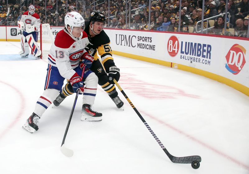 Nov 2, 2024; Pittsburgh, Pennsylvania, USA;  Pittsburgh Penguins center Noel Acciari (55) chips the puck away from Montreal Canadiens right wing Cole Caufield (13) during the first period at PPG Paints Arena. Mandatory Credit: Charles LeClaire-Imagn Images