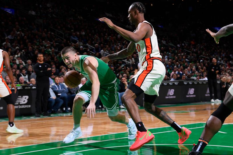 BOSTON, MA - DECEMBER 4: Payton Pritchard #11 of the Boston Celtics drives to the basket during the game against the Detroit Pistons on December 4, 2024 at TD Garden in Boston, Massachusetts. NOTE TO USER: User expressly acknowledges and agrees that, by downloading and/or using this Photograph, user is consenting to the terms and conditions of the Getty Images License Agreement. Mandatory Copyright Notice: Copyright 2024 NBAE (Photo by Brian Babineau/NBAE via Getty Images)