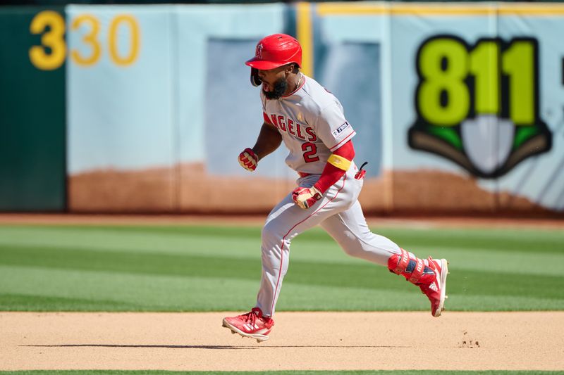 Sep 3, 2023; Oakland, California, USA; Los Angeles Angels infielder Luis Rengifo (2) reacts while running the bases after hitting a one run home run against the Oakland Athletics during the seventh inning at Oakland-Alameda County Coliseum. Mandatory Credit: Robert Edwards-USA TODAY Sports