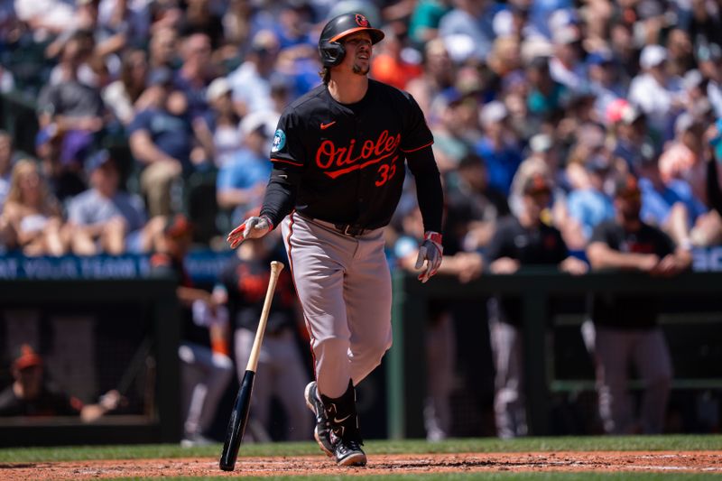 Jun 5, 2025; Seattle, Washington, USA;  Balitimore Orioles designated hitter Adley Rutschman (35) hits a two-run home run during the sixth inning against the Seattle Mariners at T-Mobile Park. Mandatory Credit: Stephen Brashear-Imagn Images