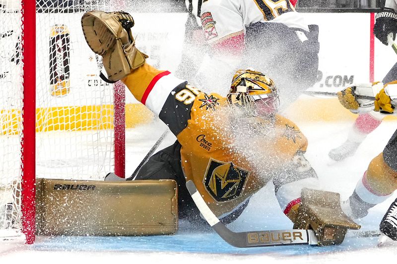 Jan 4, 2024; Las Vegas, Nevada, USA; Vegas Golden Knights goaltender Logan Thompson (36) makes a save against Florida Panthers left wing Matthew Tkachuk (19) during the third period at T-Mobile Arena. Mandatory Credit: Stephen R. Sylvanie-USA TODAY Sports