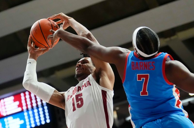 Jan 14, 2025; Tuscaloosa, AL, USA;  Alabama forward Jarin Stevenson (15) shoots against Ole Miss guard Davon Barnes (7) at Coleman Coliseum. Mandatory Credit: Gary Cosby Jr.-USA TODAY Network via Imagn Images