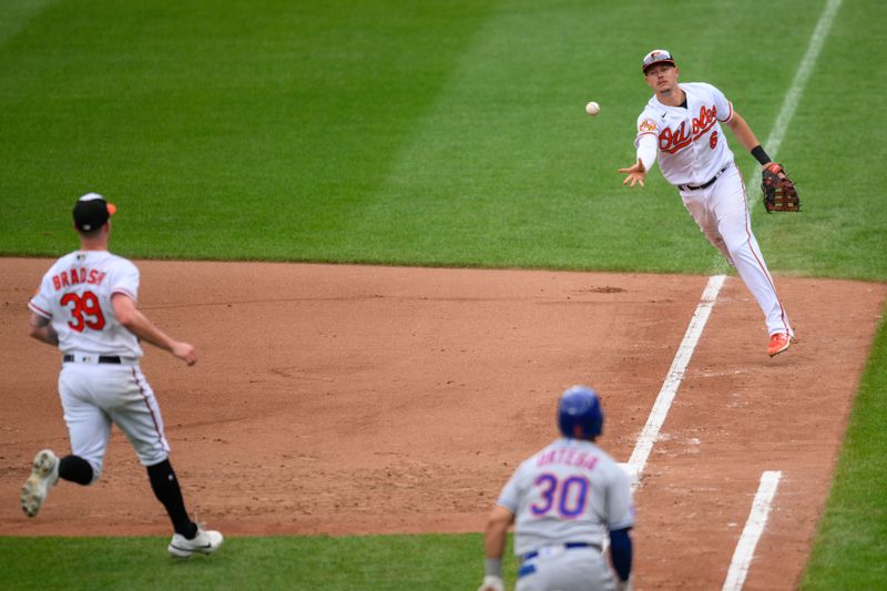 Aug 6, 2023; Baltimore, Maryland, USA; Baltimore Orioles first baseman Ryan Mountcastle (6) tosses the ball to starting pitcher Kyle Bradish (39) to force out New York Mets center fielder Rafael Ortega (30) at first base during the fourth inning at Oriole Park at Camden Yards. Mandatory Credit: Reggie Hildred-USA TODAY Sports