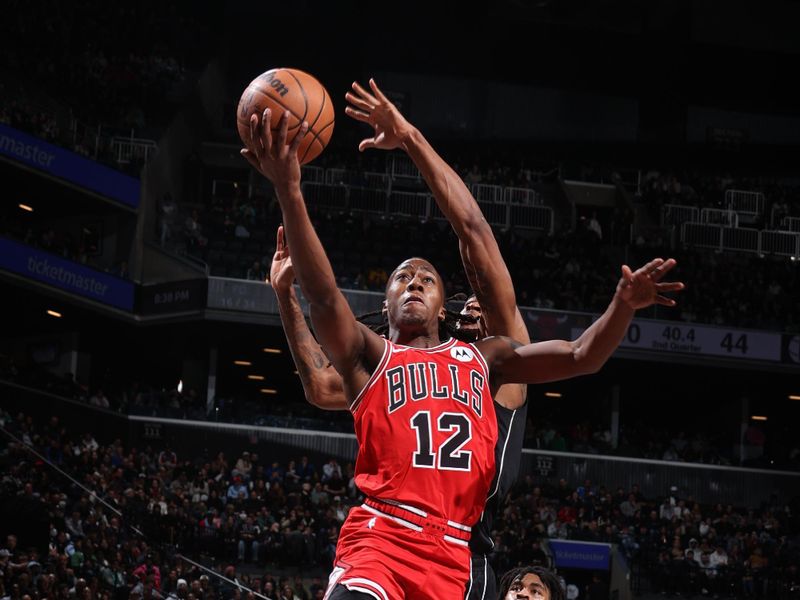 BROOKLYN, NY - MARCH 29: Ayo Dosunmu #12 of the Chicago Bulls drives to the basket during the game against the Brooklyn Nets on March 29, 2024 at Barclays Center in Brooklyn, New York. NOTE TO USER: User expressly acknowledges and agrees that, by downloading and or using this Photograph, user is consenting to the terms and conditions of the Getty Images License Agreement. Mandatory Copyright Notice: Copyright 2024 NBAE (Photo by Nathaniel S. Butler/NBAE via Getty Images)