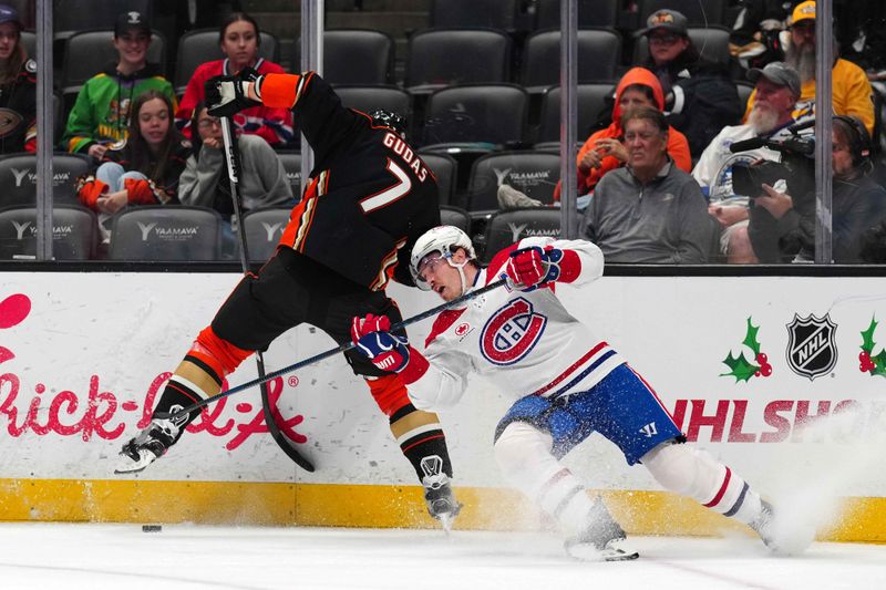 Nov 22, 2023; Anaheim, California, USA; Montreal Canadiens right wing Brendan Gallagher (11) and Anaheim Ducks defenseman Radko Gudas (7) battle for the puck in the first period at Honda Center. Mandatory Credit: Kirby Lee-USA TODAY Sports