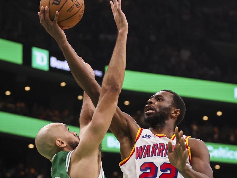 BOSTON, MA - NOVEMBER 6  Andrew Wiggins #22 of the Golden State Warriors drives to the basket while guarded by Derrick White #9 of the Boston Celtics during the third quarter of a game at TD Garden on November 6, 2024 in Boston, Massachusetts. NOTE TO USER: User expressly acknowledges and agrees that, by downloading and or using this photograph, User is consenting to the terms and conditions of the Getty Images License Agreement. (Photo by Adam Glanzman/Getty Images)