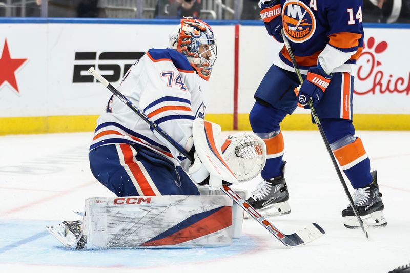 Oct 16, 2025; Elmont, New York, USA; Edmonton Oilers goaltender Stuart Skinner (74) defends the net in the second period against the New York Islanders at UBS Arena. Mandatory Credit: Wendell Cruz-Imagn Images