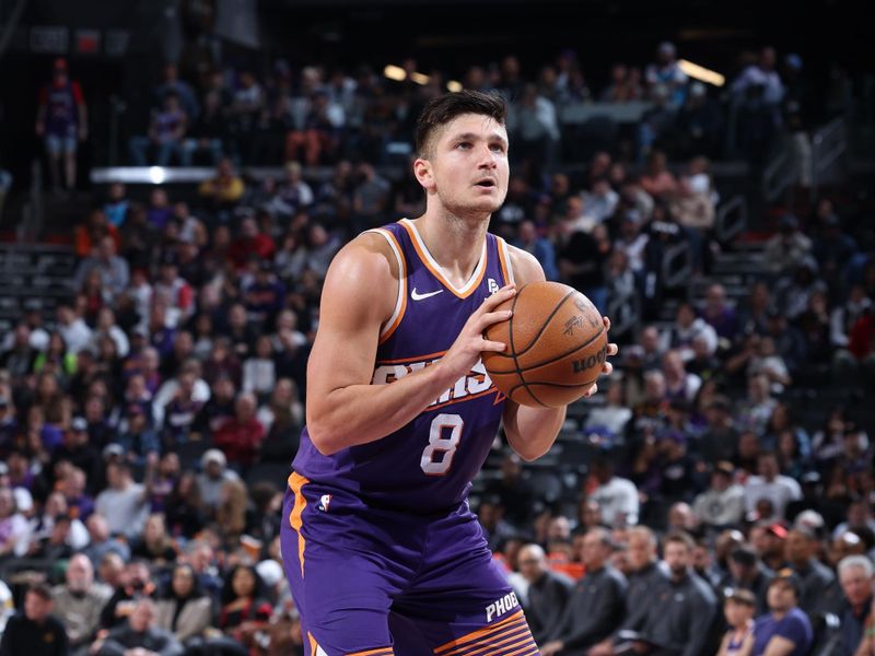 PHOENIX, AZ - MARCH 7: Grayson Allen #8 of the Phoenix Suns shoots a free throw during the game against the Toronto Raptors on March 7, 2024 at Footprint Center in Phoenix, Arizona. NOTE TO USER: User expressly acknowledges and agrees that, by downloading and or using this photograph, user is consenting to the terms and conditions of the Getty Images License Agreement. Mandatory Copyright Notice: Copyright 2024 NBAE (Photo by Jeff Haynes/NBAE via Getty Images)