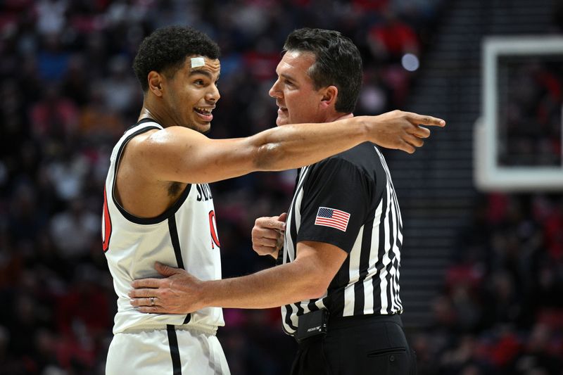 Jan 25, 2023; San Diego, California, USA;San Diego State Aztecs guard Matt Bradley (20) gestures toward the Utah State Aggies bench while talking to an official during the first half at Viejas Arena. Mandatory Credit: Orlando Ramirez-USA TODAY Sports