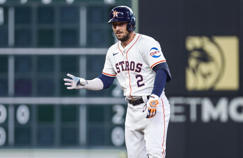 Jul 10, 2024; Houston, Texas, USA; Houston Astros third baseman Alex Bregman (2) signals towards the dugout after reaching second base during the second inning against the Miami Marlins at Minute Maid Park. Mandatory Credit: Troy Taormina-USA TODAY Sports