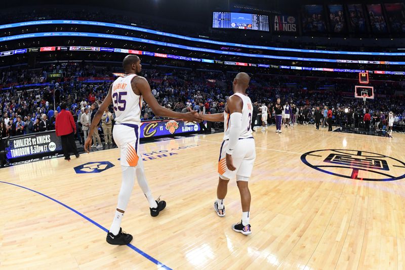 LOS ANGELES, CA - APRIL 20: Kevin Durant #35 of the Phoenix Suns high fives Chris Paul #3 of the Phoenix Suns after the game against the LA Clippers during Round 1 Game 3 of the 2023 NBA Playoffs on April 20, 2023 at Crypto.Com Arena in Los Angeles, California. NOTE TO USER: User expressly acknowledges and agrees that, by downloading and/or using this Photograph, user is consenting to the terms and conditions of the Getty Images License Agreement. Mandatory Copyright Notice: Copyright 2023 NBAE (Photo by Andrew D. Bernstein/NBAE via Getty Images)