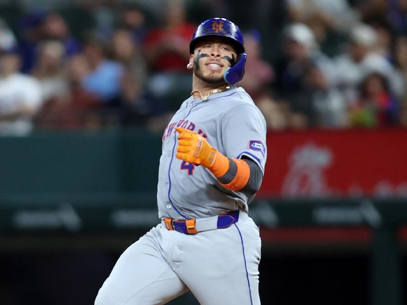 Jun 18, 2024; Arlington, Texas, USA; New York Mets catcher Francisco Alvarez (4) reacts as he runs to second base after driving in two runs in the eighth inning against the Texas Rangers at Globe Life Field. Mandatory Credit: Tim Heitman-USA TODAY Sports