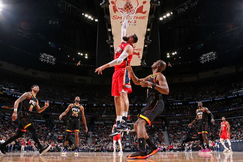 NEW ORLEANS, LA - DECEMBER 9: Jonas Valanciunas #17 of the New Orleans Pelicans dunks the ball against the Phoenix Suns on December 9, 2022 at the Smoothie King Center in New Orleans, Louisiana. NOTE TO USER: User expressly acknowledges and agrees that, by downloading and or using this Photograph, user is consenting to the terms and conditions of the Getty Images License Agreement. Mandatory Copyright Notice: Copyright 2022 NBAE (Photo by Layne Murdoch Jr./NBAE via Getty Images)