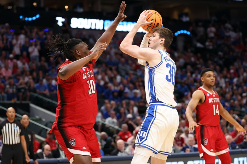 Mar 31, 2024; Dallas, TX, USA; Duke Blue Devils center Kyle Filipowski (30) shoots against North Carolina State Wolfpack forward DJ Burns Jr. (30) in the first half in the finals of the South Regional of the 2024 NCAA Tournament at American Airline Center. Mandatory Credit: Kevin Jairaj-USA TODAY Sports