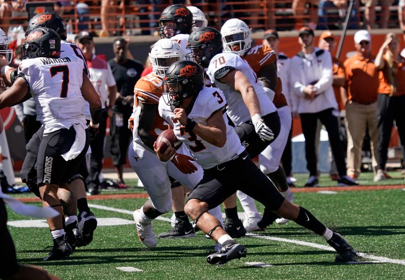 Oct 16, 2021; Austin, Texas, USA; Oklahoma State Cowboys quarterback Spencer Sanders (3) runs in to the end zone for a touchdown in second half against the Texas Longhorns at Darrell K Royal-Texas Memorial Stadium. Mandatory Credit: Scott Wachter-USA TODAY Sports