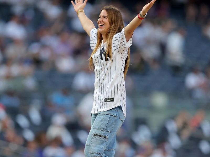 Jul 26, 2023; Bronx, New York, USA; New York Liberty player Sabrina Ionescu reacts after throwing out a ceremonial first pitch before a game between the New York Yankees and New York Mets at Yankee Stadium. Mandatory Credit: Brad Penner-USA TODAY Sports