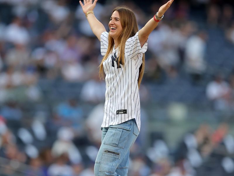 Jul 26, 2023; Bronx, New York, USA; New York Liberty player Sabrina Ionescu reacts after throwing out a ceremonial first pitch before a game between the New York Yankees and New York Mets at Yankee Stadium. Mandatory Credit: Brad Penner-USA TODAY Sports