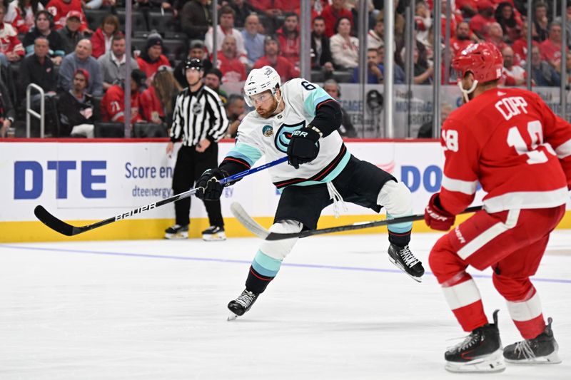 Oct 24, 2023; Detroit, Michigan, USA; Seattle Kraken defenseman Adam Larsson (6) shoots the puck against the Detroit Red Wings in the third period at Little Caesars Arena. Mandatory Credit: Lon Horwedel-USA TODAY Sports