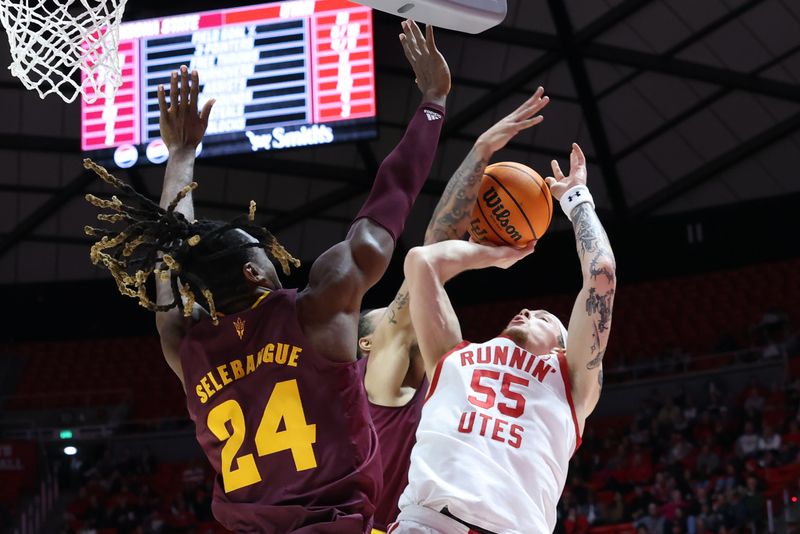 Feb 10, 2024; Salt Lake City, Utah, USA; Utah Utes guard Gabe Madsen (55) goes to the basket against Arizona State Sun Devils guard Frankie Collins (1) and forward Bryant Selebangue (24) during the second half at Jon M. Huntsman Center. Mandatory Credit: Rob Gray-USA TODAY Sports