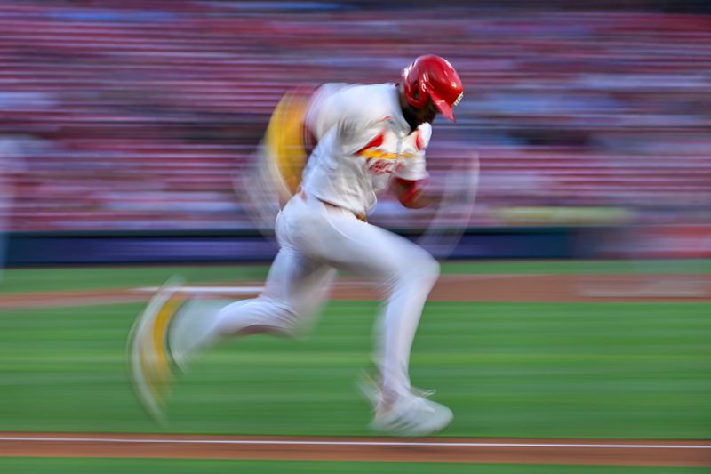 Jul 10, 2025; St. Louis, Missouri, USA;  St. Louis Cardinals center fielder Victor Scott II (11) runs to first base against the Washington Nationals during the second inning at Busch Stadium. Mandatory Credit: Jeff Curry-Imagn Images