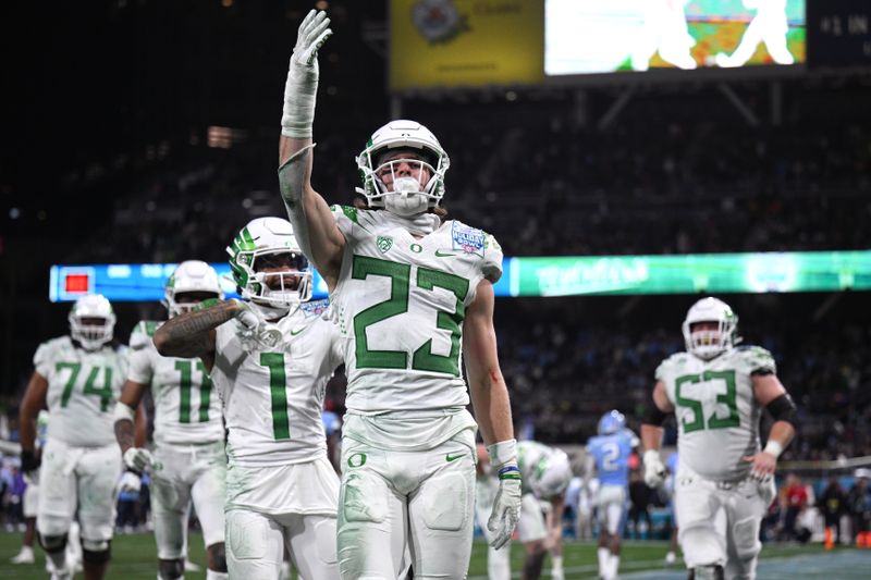 Dec 28, 2022; San Diego, CA, USA; Oregon Ducks wide receiver Chase Cota (23) celebrates after scoring a touchdown against the North Carolina Tar Heels during the second half of the 2022 Holiday Bowl at Petco Park. Mandatory Credit: Orlando Ramirez-USA TODAY Sports