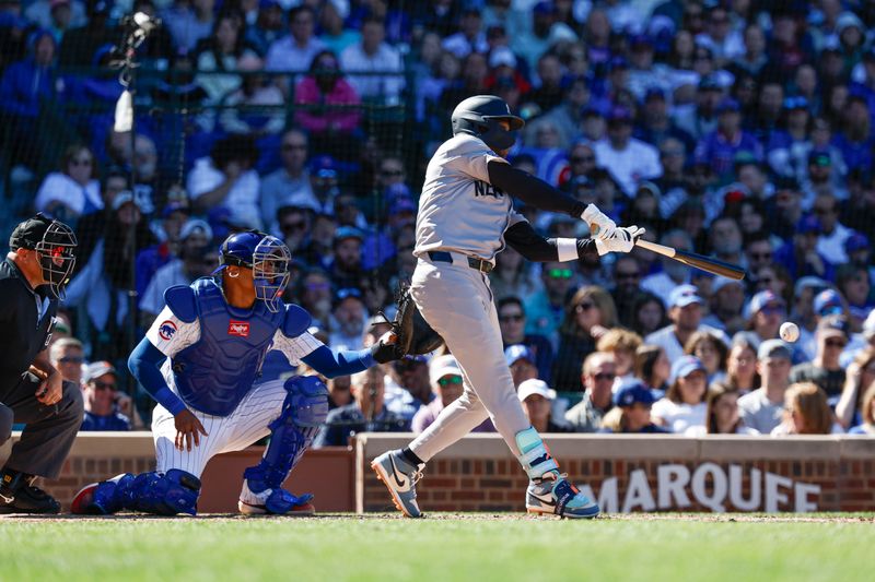 Sep 7, 2024; Chicago, Illinois, USA; New York Yankees third baseman Jazz Chisholm Jr. (13) singles against the Chicago Cubs during the sixth inning at Wrigley Field. Mandatory Credit: Kamil Krzaczynski-Imagn Images