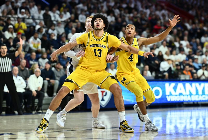 Jan 7, 2024; Philadelphia, Pennsylvania, USA; Michigan Wolverines forward Olivier Nkamhoua (13) and guard Nimari Burnett (4) box out Penn State Nittany Lions forward Leo O'Boyle (11)  in the first half at The Palestra. Mandatory Credit: Kyle Ross-USA TODAY Sports