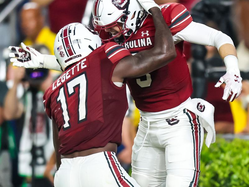 Sep 9, 2023; Columbia, South Carolina, USA; South Carolina Gamecocks wide receiver Xavier Legette (17) and quarterback/wide receiver Luke Doty (9) celebrate a touchdown reception by Doty against the Furman Paladins during the second quarter at Williams-Brice Stadium. Mandatory Credit: Jeff Blake-USA TODAY Sports